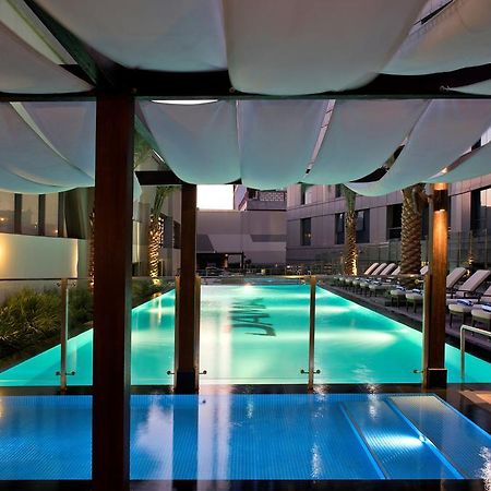 Damac Maison The Vogue Dubai Bagian luar foto The pool at the hotel