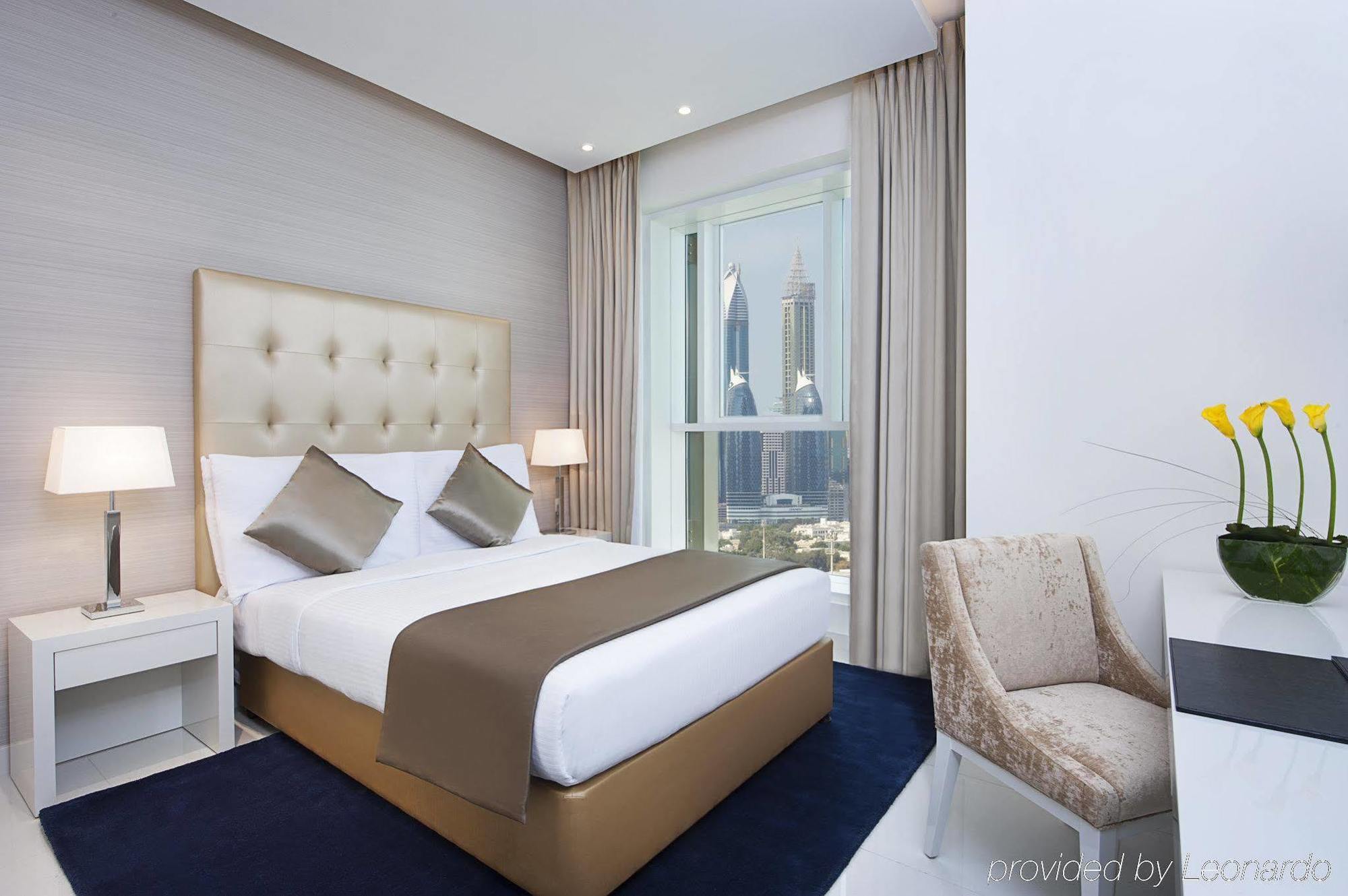 Damac Maison The Vogue Dubai Bagian luar foto A bedroom at the hotel