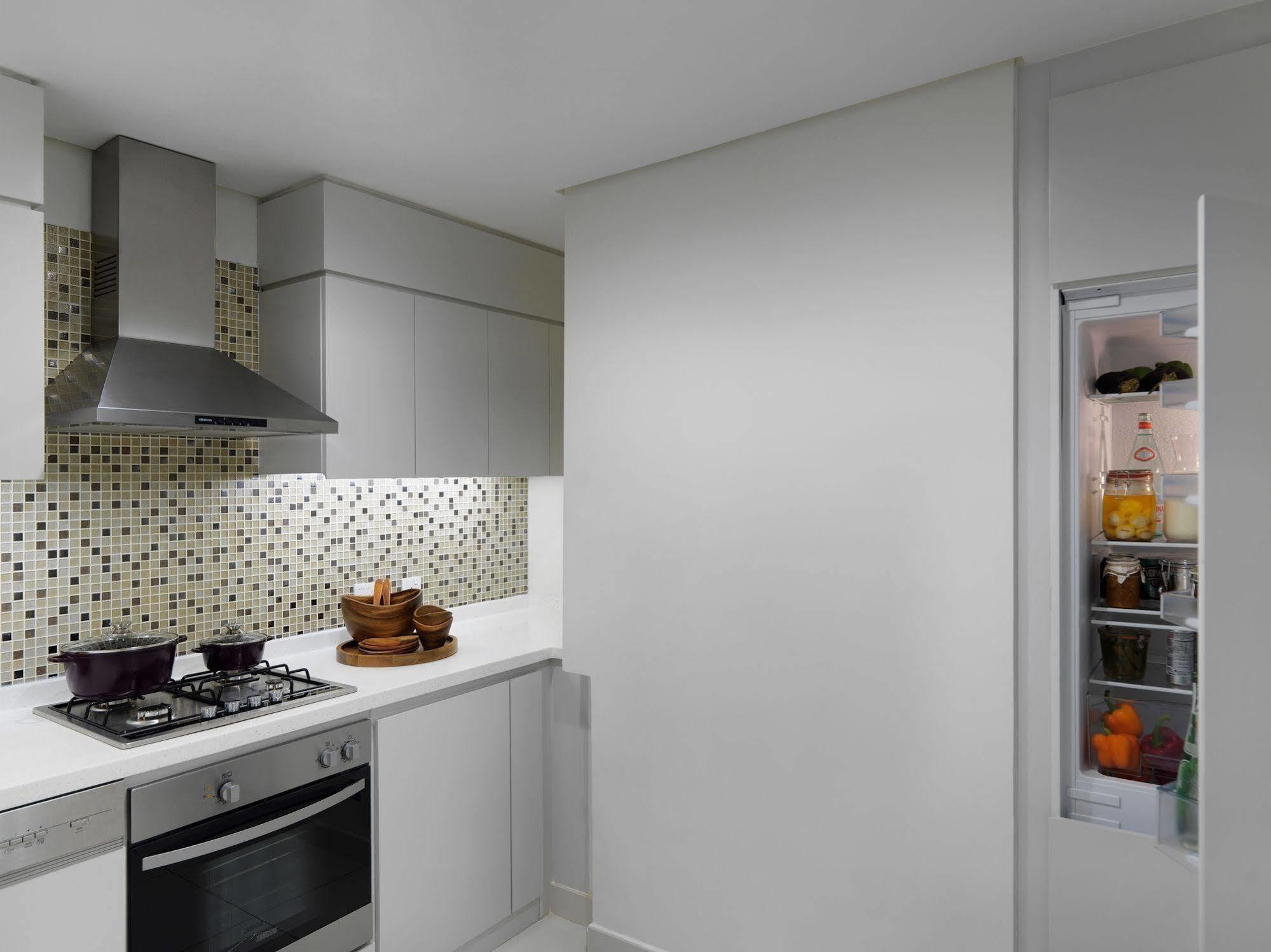 Damac Maison The Vogue Dubai Bagian luar foto A built-in refrigerator